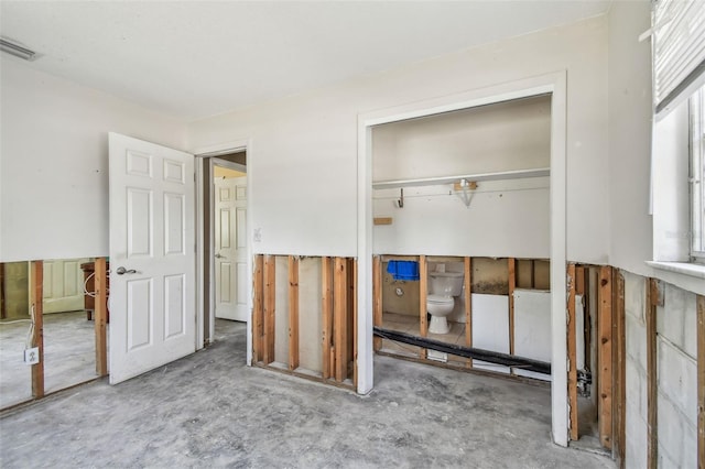 123 14th Ave, Indian Rocks Beach, FL 33785 - unfurnished bedroom featuring a closet and concrete flooring