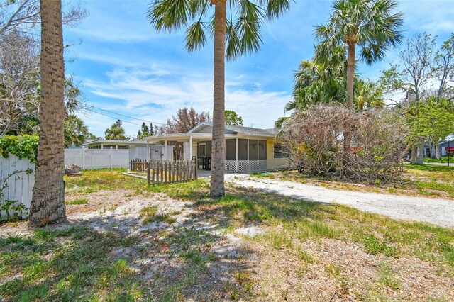 123 14th Ave, Indian Rocks Beach, FL 33785 - view of front of home featuring a sunroom
