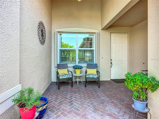 15860 Aurora Lake Cir, Wimauma, FL 33598 - view of exterior entry featuring stucco siding
