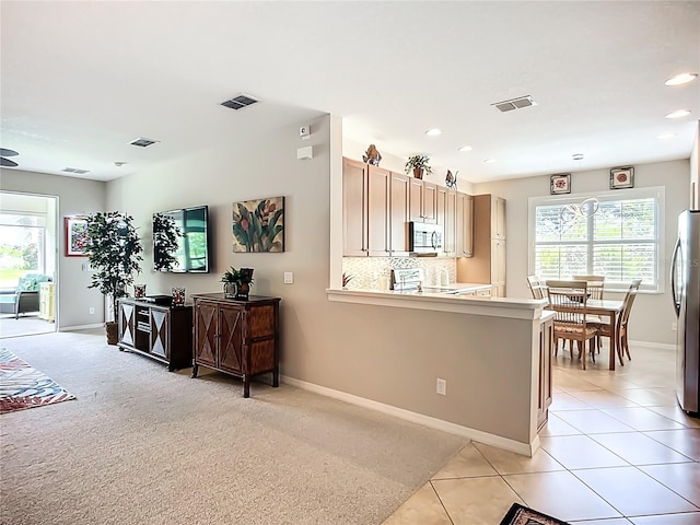 15860 Aurora Lake Cir, Wimauma, FL 33598 - kitchen with appliances with stainless steel finishes, baseboards, plenty of natural light, and recessed lighting