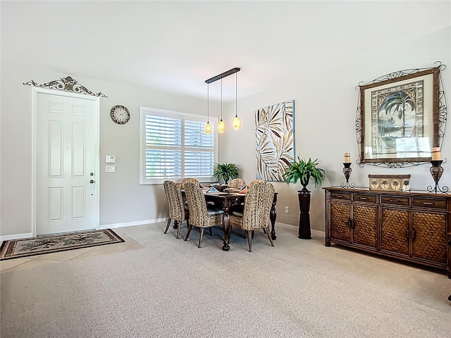 15860 Aurora Lake Cir, Wimauma, FL 33598 - dining area with light carpet and baseboards