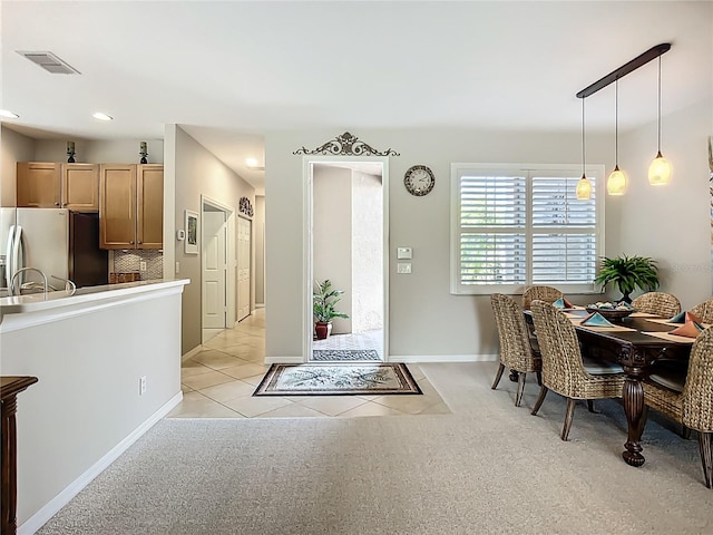 15860 Aurora Lake Cir, Wimauma, FL 33598 - dining area featuring light tile patterned flooring, light carpet, recessed lighting, and baseboards