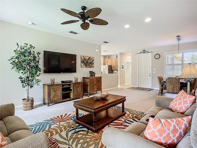 15860 Aurora Lake Cir, Wimauma, FL 33598 - living area featuring light colored carpet, baseboards, a ceiling fan, and recessed lighting