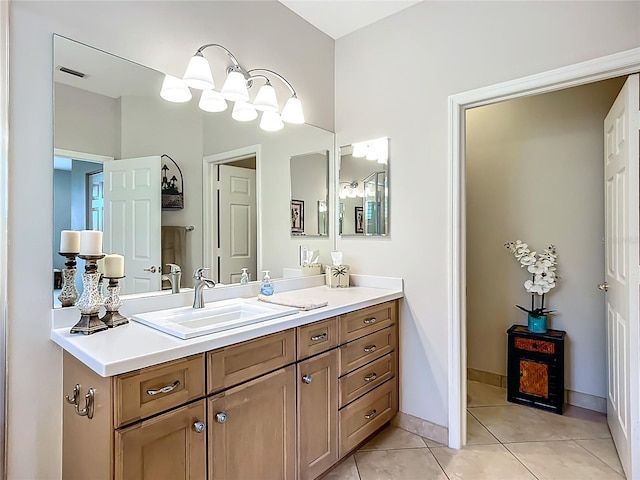 15860 Aurora Lake Cir, Wimauma, FL 33598 - bathroom featuring vanity, tile patterned flooring, and baseboards