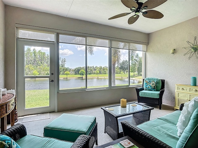 15860 Aurora Lake Cir, Wimauma, FL 33598 - sunroom / solarium with outdoor lounge area, ceiling fan, a water view, and view of scattered trees