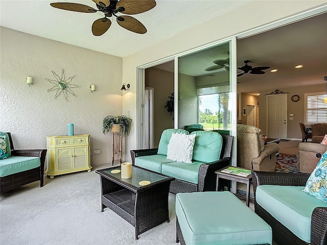 15860 Aurora Lake Cir, Wimauma, FL 33598 - carpeted living area with ceiling fan and a textured wall