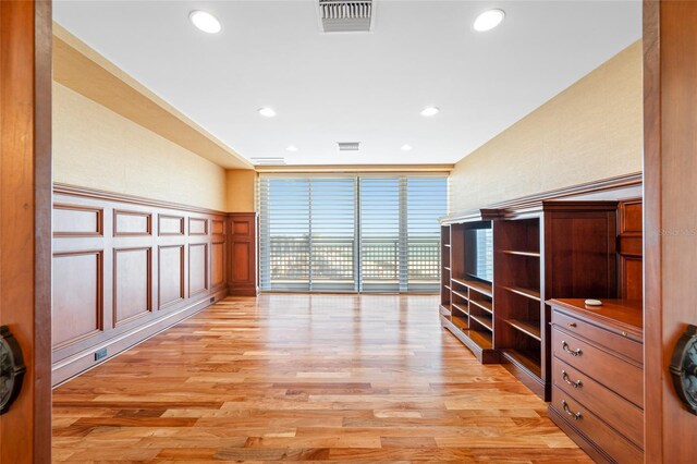 7600 Bayshore Dr Unit 1201A, Treasure Island, FL 33706 - living room featuring light wood finished floors, recessed lighting, and a decorative wall