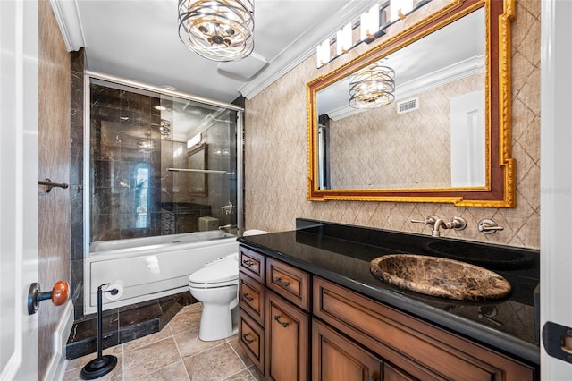 7600 Bayshore Dr Unit 1201A, Treasure Island, FL 33706 - bathroom featuring toilet, crown molding, vanity, shower / bath combination with glass door, and tile patterned floors
