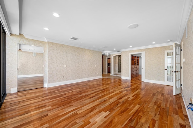 7600 Bayshore Dr Unit 1201A, Treasure Island, FL 33706 - unfurnished living room with crown molding, wood finished floors, recessed lighting, and wallpapered walls