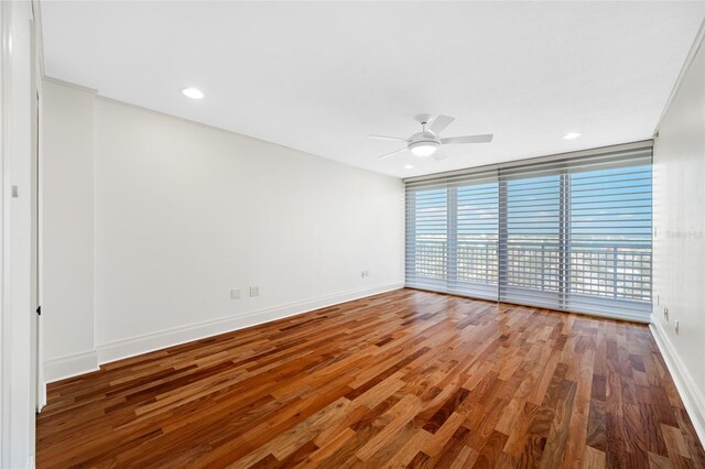 7600 Bayshore Dr Unit 1201A, Treasure Island, FL 33706 - empty room featuring ceiling fan, baseboards, wood finished floors, and recessed lighting
