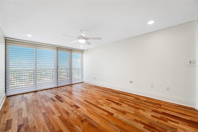 7600 Bayshore Dr Unit 1201A, Treasure Island, FL 33706 - spare room featuring ceiling fan, baseboards, wood finished floors, and recessed lighting