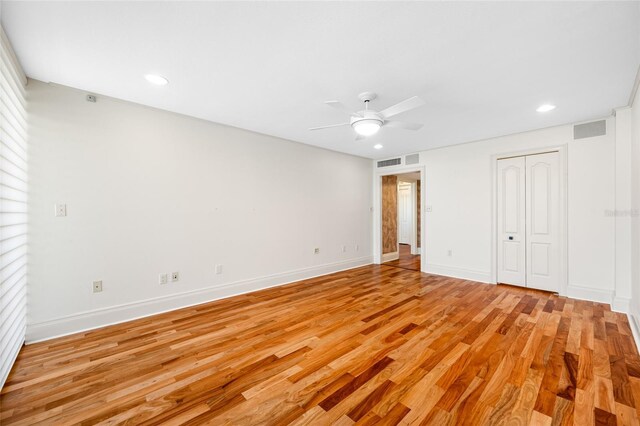 7600 Bayshore Dr Unit 1201A, Treasure Island, FL 33706 - unfurnished bedroom featuring light wood finished floors, recessed lighting, baseboards, and ceiling fan