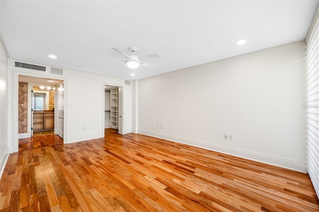 7600 Bayshore Dr Unit 1201A, Treasure Island, FL 33706 - unfurnished bedroom with light wood finished floors, baseboards, recessed lighting, a ceiling fan, and a closet