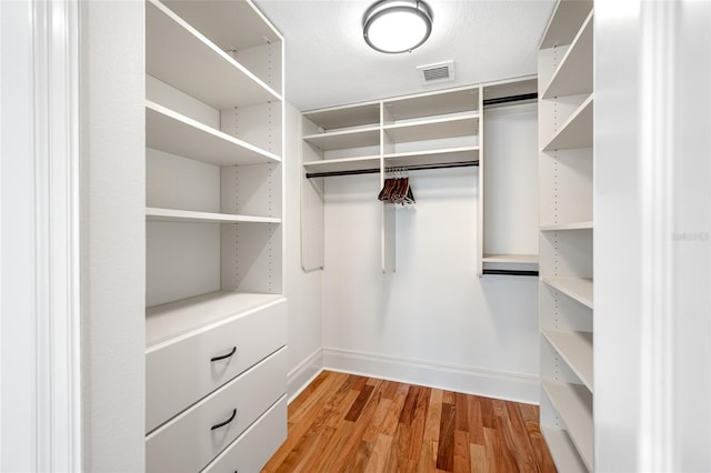 7600 Bayshore Dr Unit 1201A, Treasure Island, FL 33706 - walk in closet with light wood-style flooring