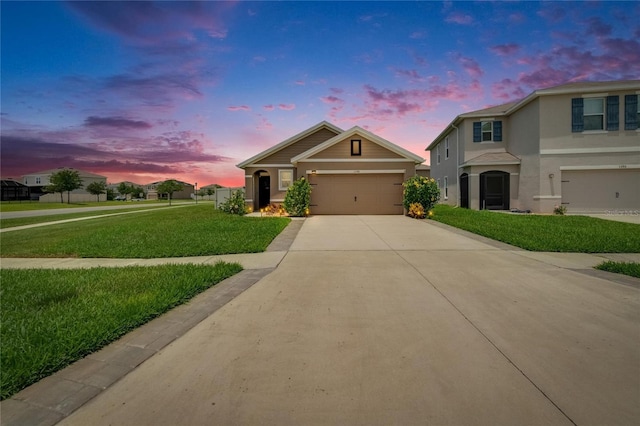 1398 Crescent Hoop Way, Wesley Chapel, FL 33543 - view of front of property with a front yard, driveway, stucco siding, and a garage
