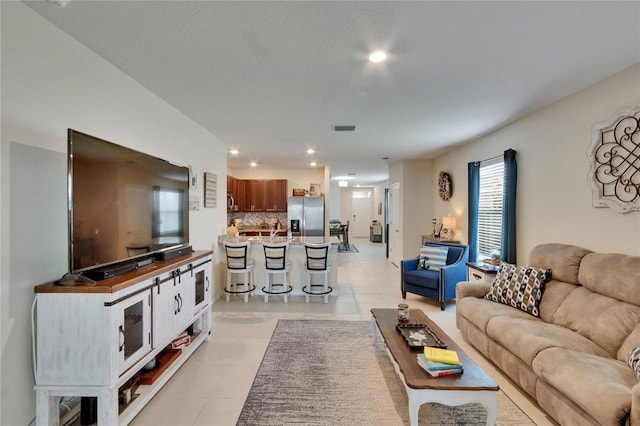 1398 Crescent Hoop Way, Wesley Chapel, FL 33543 - living area with recessed lighting and light tile patterned floors