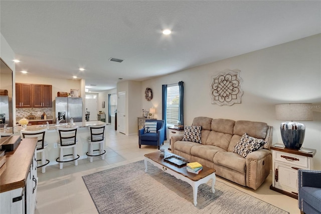 1398 Crescent Hoop Way, Wesley Chapel, FL 33543 - living room featuring light tile patterned flooring and recessed lighting