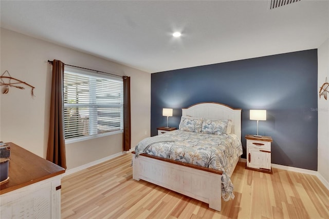 1398 Crescent Hoop Way, Wesley Chapel, FL 33543 - bedroom with wood finished floors and baseboards