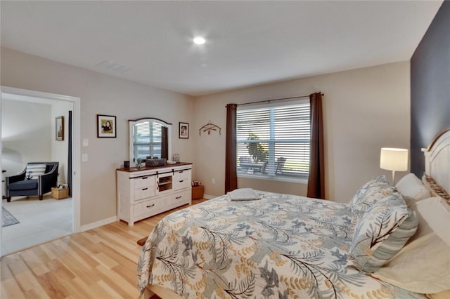 1398 Crescent Hoop Way, Wesley Chapel, FL 33543 - bedroom with light wood-type flooring