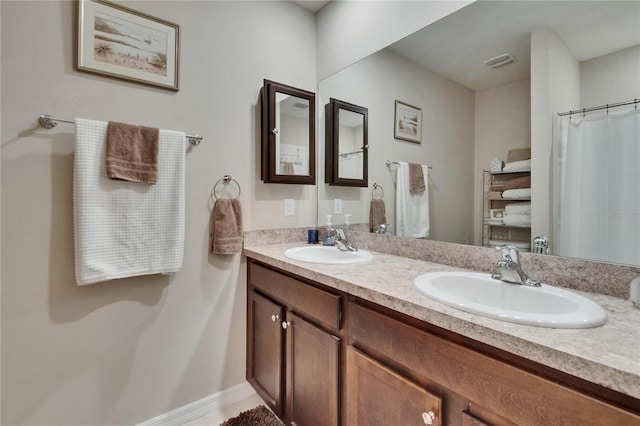 1398 Crescent Hoop Way, Wesley Chapel, FL 33543 - full bath featuring double vanity and baseboards