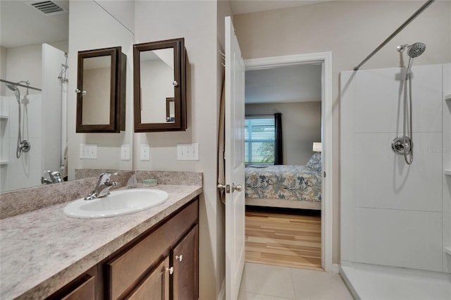 1398 Crescent Hoop Way, Wesley Chapel, FL 33543 - bathroom with a shower, vanity, tile patterned floors, and connected bathroom