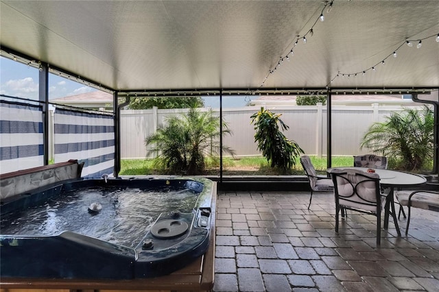 1398 Crescent Hoop Way, Wesley Chapel, FL 33543 - sunroom with a jacuzzi and outdoor dining area