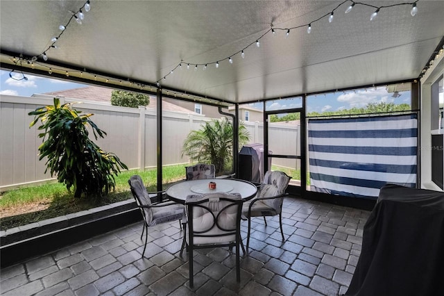 1398 Crescent Hoop Way, Wesley Chapel, FL 33543 - sunroom / solarium featuring outdoor dining space