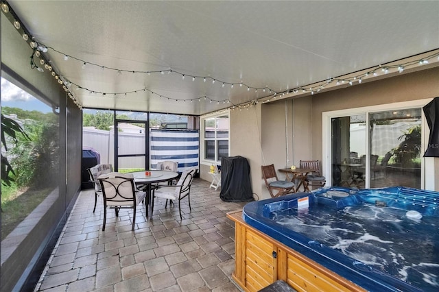 1398 Crescent Hoop Way, Wesley Chapel, FL 33543 - sunroom / solarium with a hot tub and outdoor dining space