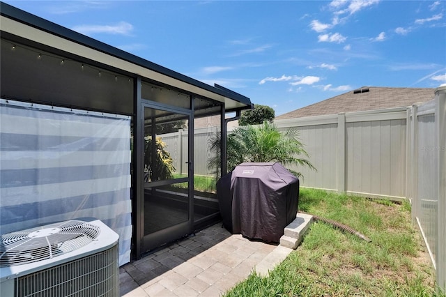 1398 Crescent Hoop Way, Wesley Chapel, FL 33543 - view of yard featuring central AC unit and a sunroom