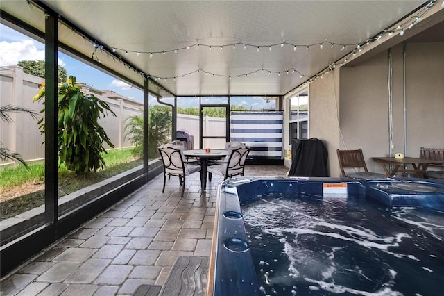 1398 Crescent Hoop Way, Wesley Chapel, FL 33543 - sunroom / solarium with a jacuzzi and outdoor dining area
