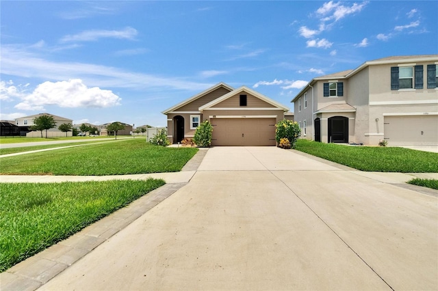 1398 Crescent Hoop Way, Wesley Chapel, FL 33543 - view of front of house with stucco siding, a front lawn, concrete driveway, and a garage