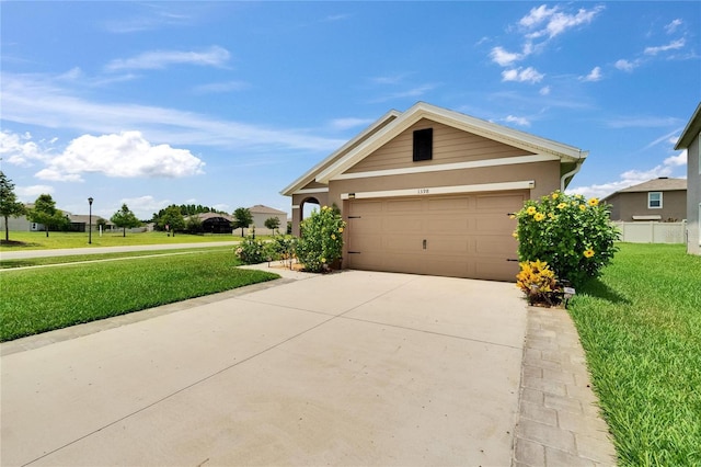 1398 Crescent Hoop Way, Wesley Chapel, FL 33543 - view of front facade with a front lawn, concrete driveway, an attached garage, and stucco siding