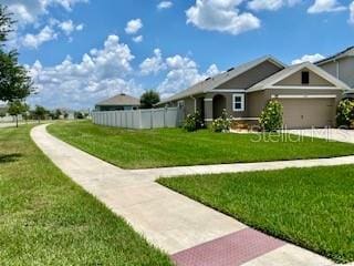 1398 Crescent Hoop Way, Wesley Chapel, FL 33543 - view of front of home with concrete driveway and an attached garage