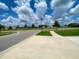 1398 Crescent Hoop Way, Wesley Chapel, FL 33543 - view of asphalt street with street lighting