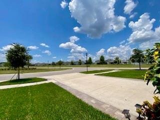 1398 Crescent Hoop Way, Wesley Chapel, FL 33543 - view of property's community with a yard