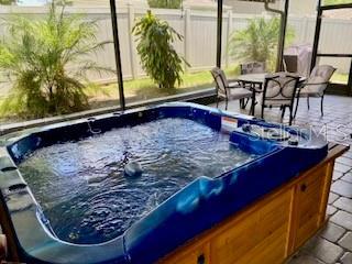 1398 Crescent Hoop Way, Wesley Chapel, FL 33543 - view of pool featuring a hot tub and a patio area