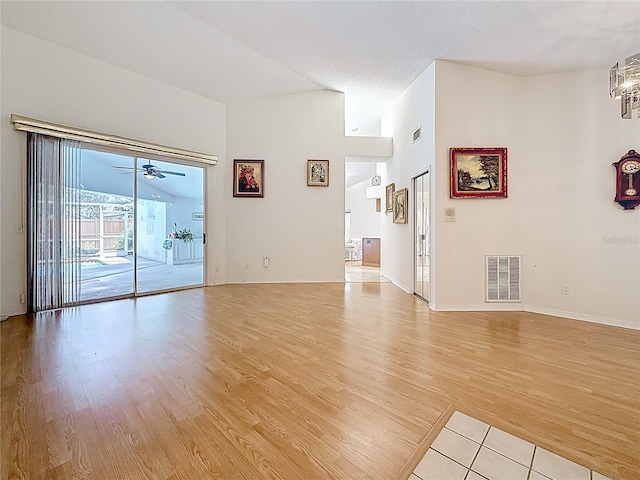 2973 Spring Oak Ct, Palm Harbor, FL 34684 - empty room with light wood-type flooring, baseboards, and ceiling fan