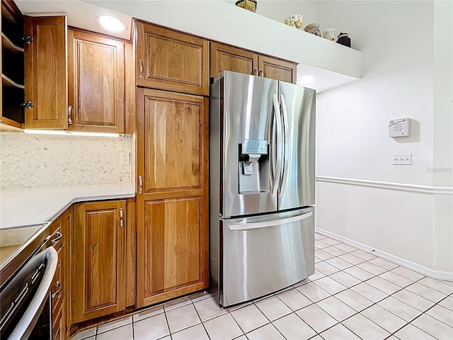 2973 Spring Oak Ct, Palm Harbor, FL 34684 - kitchen with stainless steel fridge with ice dispenser, brown cabinets, backsplash, light tile patterned floors, and recessed lighting