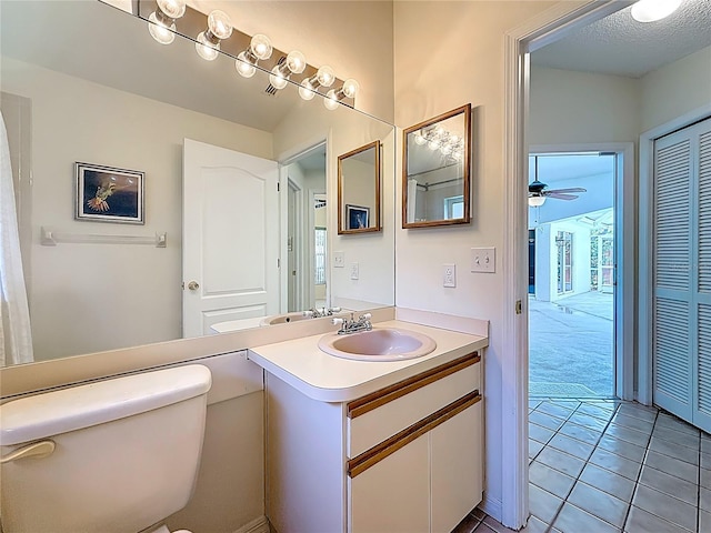 2973 Spring Oak Ct, Palm Harbor, FL 34684 - bathroom featuring toilet, vanity, tile patterned floors, and ceiling fan