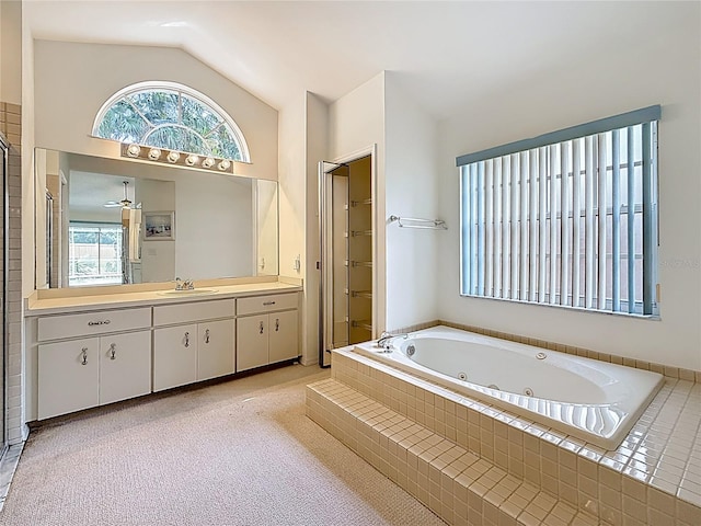 2973 Spring Oak Ct, Palm Harbor, FL 34684 - full bath featuring plenty of natural light, lofted ceiling, vanity, a tub with jets, and a shower