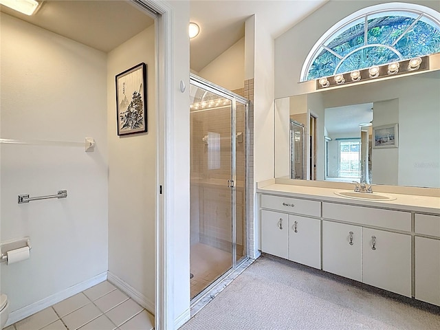 2973 Spring Oak Ct, Palm Harbor, FL 34684 - full bathroom featuring vanity, a stall shower, toilet, tile patterned floors, and baseboards