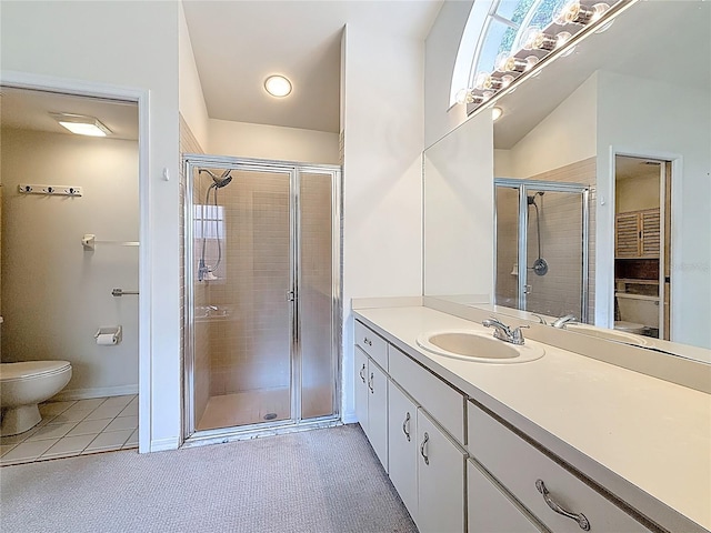 2973 Spring Oak Ct, Palm Harbor, FL 34684 - bathroom featuring toilet, a stall shower, vanity, tile patterned floors, and baseboards