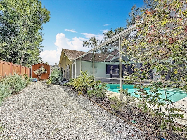 2973 Spring Oak Ct, Palm Harbor, FL 34684 - back of property with stucco siding and a lanai