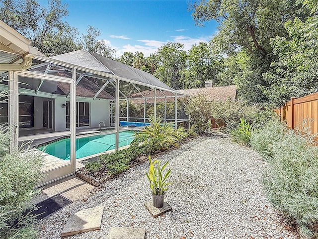 2973 Spring Oak Ct, Palm Harbor, FL 34684 - swimming pool featuring a patio area and glass enclosure