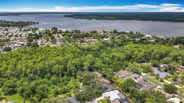2973 Spring Oak Ct, Palm Harbor, FL 34684 - aerial view of property's location with a nearby body of water, a forest, and nearby suburban area