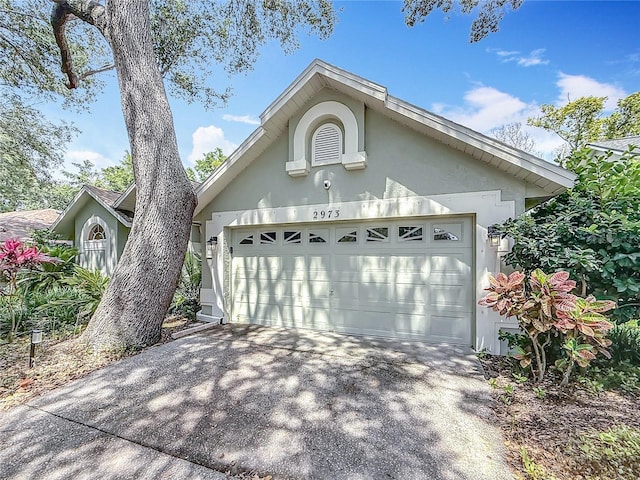 2973 Spring Oak Ct, Palm Harbor, FL 34684 - garage featuring concrete driveway