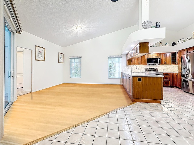 2973 Spring Oak Ct, Palm Harbor, FL 34684 - kitchen featuring stainless steel appliances, backsplash, open floor plan, open shelves, and a peninsula