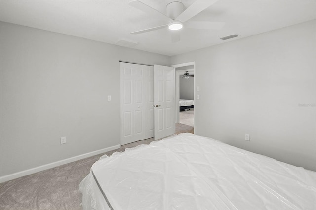 4299 Bellaire Dr, Hernando Beach, FL 34607 - bedroom featuring carpet floors, baseboards, ceiling fan, and a closet