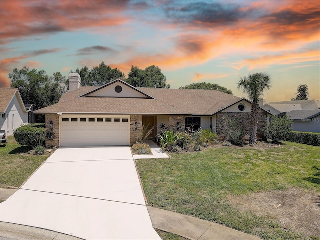 8521 Caitlin Ct, Hudson, FL 34667 - ranch-style house featuring an attached garage, a front lawn, concrete driveway, a chimney, and a shingled roof