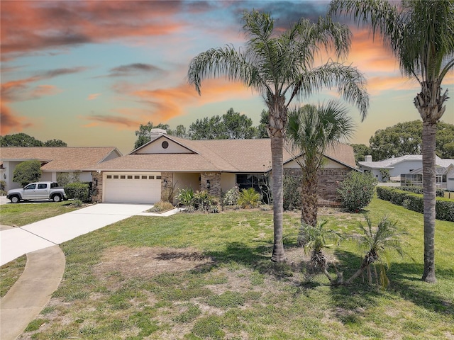 8521 Caitlin Ct, Hudson, FL 34667 - ranch-style home with a garage, a lawn, concrete driveway, and stone siding